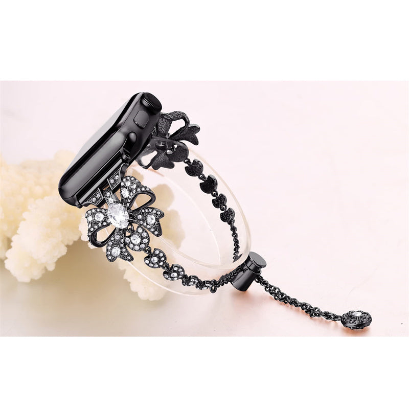 For Apple Watch Series 8 / 7 41mm / 6 / 5 / 4 / SE / SE (2022) 40mm / 3 / 2 / 1 38mm Rhinestones Decor Bowknot Bracelet Metal Watch Strap Adjustable Wrist Band - Black - UNIQBUY