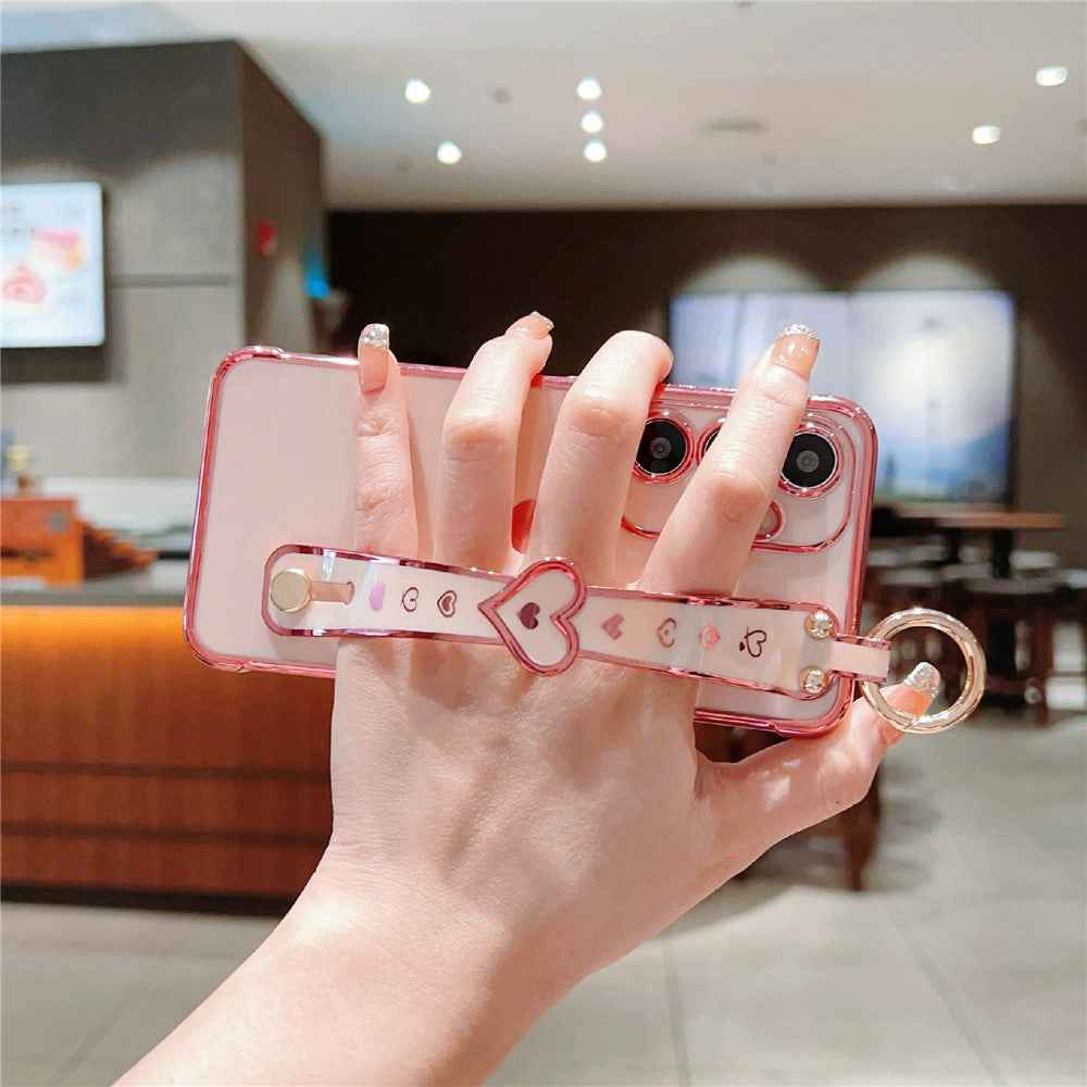 For Samsung Galaxy A57 5G Case Wristband Kickstand Electroplated Love Heart TPU Phone Cover Finger Holder - Pink
