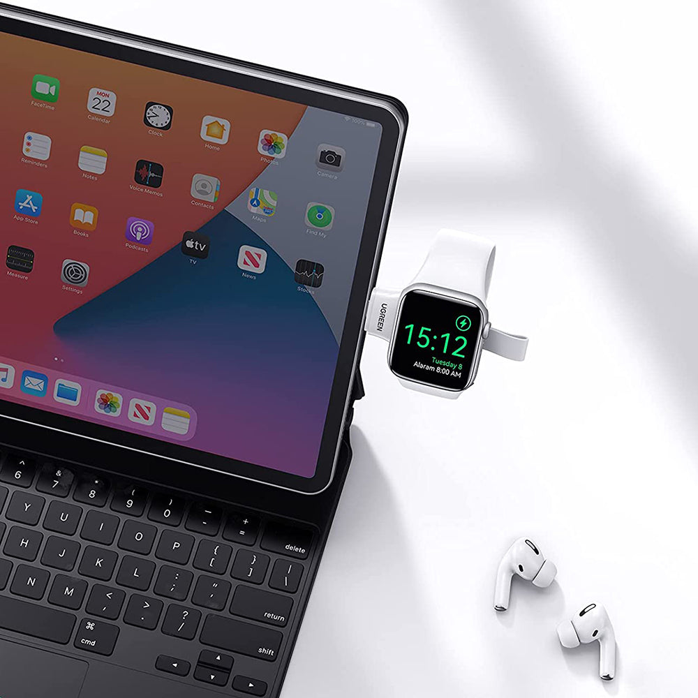 a cell phone sitting on top of a laptop 